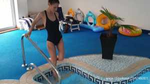 jess-black-puma-swimsuit-in-the-pool-and